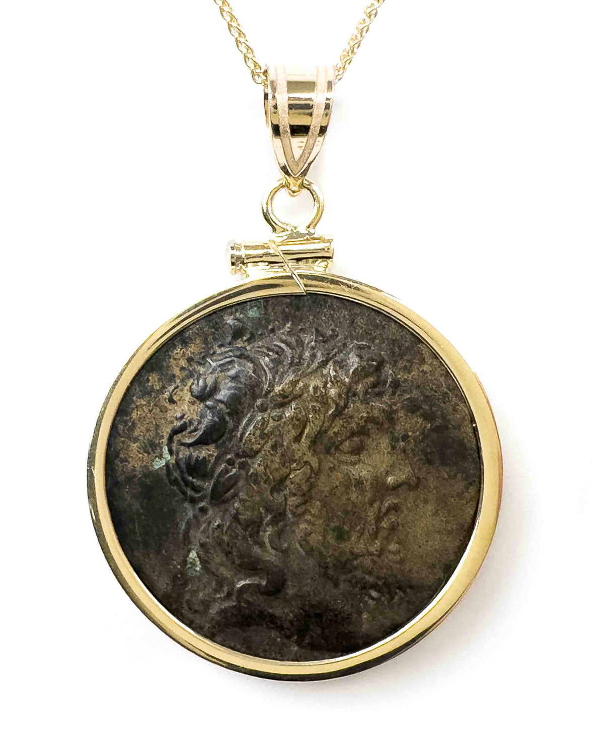 Close up photos of 14k Gold bezel-set pendant with real Ancient Greek bronze Zeus coin.